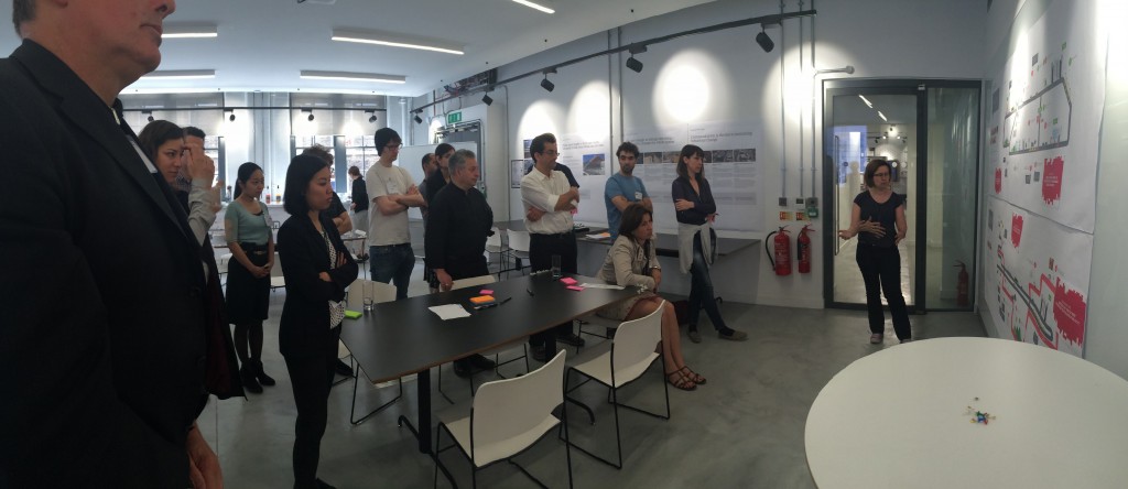 Participants examining research relating to mobility in the city, during one of two the "OrganiCity Futures" workshops, May 2016. 